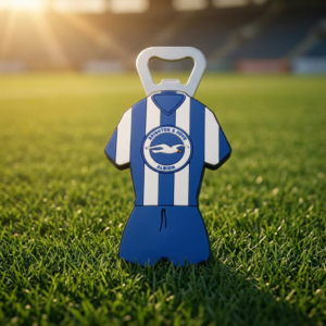 Custom 3D PVC Bottle Openers Football Jersey & Soccer Club Custom 3D PVC bottle opener shaped like a blue and white striped football jersey with Brighton & Hove Albion seagull badge on green grass background