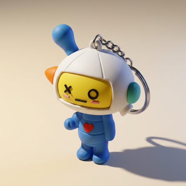 Custom 3D PVC rubber keychain featuring a cute robot character with yellow face, blue body, red heart, and antenna on white background