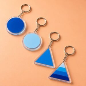 Custom Acrylic Keychains Minimalist Geometric Color-Block Transparent Charms Acrylic geometric keychains featuring solid-color circular discs and gradient triangular pendants, encased in crystal-clear edges and paired with metallic chains against a warm ochre backdrop.