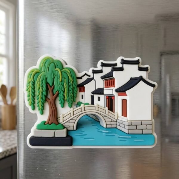 Custom PVC Fridge Magnet Jiangnan Water Town Scenery Soft Rubber Magnet Jiangnan water town scenery PVC fridge magnet with a 3D embossed design featuring white-walled black-tiled buildings, a stone arch bridge, weeping willows, and a blue river — a Chinese cultural creative souvenir — displayed on a pure white background