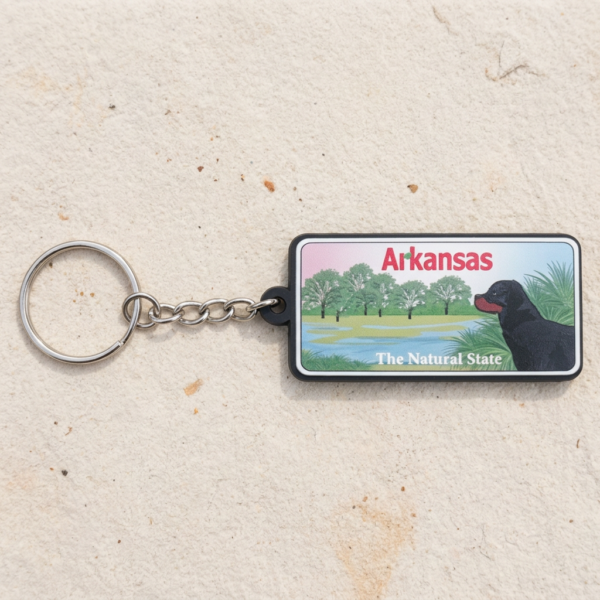 Custom PVC Keychains Arkansas State Souvenir Custom printed PVC keychain featuring Arkansas state illustration with trees, dog, water and 'The Natural State' text on wood background