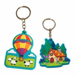 Set of 2 custom PVC rubber keychains with hot air balloon and sheep, fairy tale house with elf, colorful cartoon charms on white background