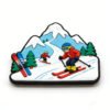 Cartoon-style PVC soft rubber ski figurine fridge magnet featuring downhill skiers, snowy mountain peaks, and evergreen trees in vibrant red, blue, and yellow, with 3D epoxy dome finish, displayed on plain white background.