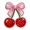 Custom sequin embroidered patch featuring a pink sequin bow paired with two red sequin cherries with green stems and white overlock edging, on a pure white background