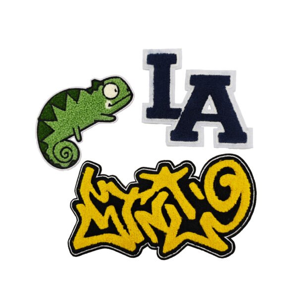 Towel embroidery patch set including a green cartoon chameleon, dark blue "LA" vintage varsity letters and yellow-black street graffiti script; crafted with thick loop pile embroidery, backed with heat-seal adhesive, ideal for DIY decoration on denim jackets, backpacks or bucket hats.