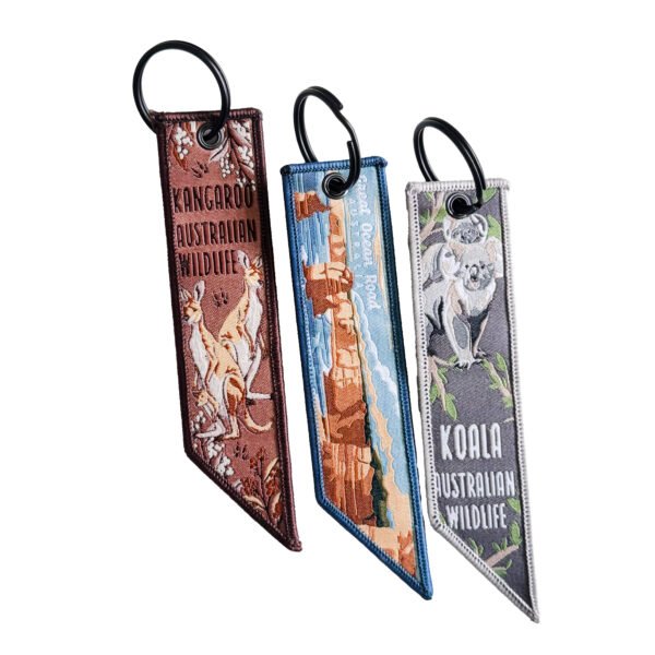 Australian themed double-sided embroidery patch featuring kangaroo, Uluru Rock, and koala designs; high-density embroidery supporting custom corporate logos, equipped with a metal snap hook.