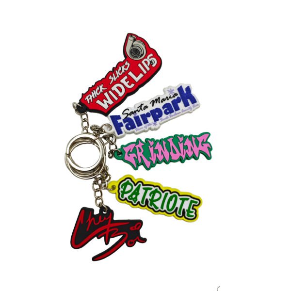 Streetwear PVC soft rubber keychain featuring bold graffiti-style typography (e.g., WIDELIPS, GRINDING), vibrant 3D colors, supports custom logo and text imprint, essential urban accessory.