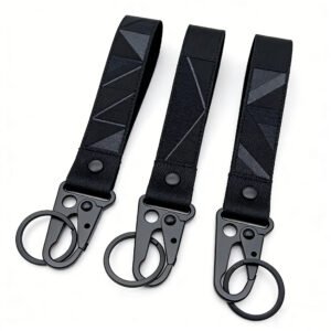 Black nylon webbing keychain featuring a red-and-white geometric triangular camouflage pattern, paired with a black metal tactical snap hook; durable and abrasion-resistant, supports custom corporate logos or team insignias.