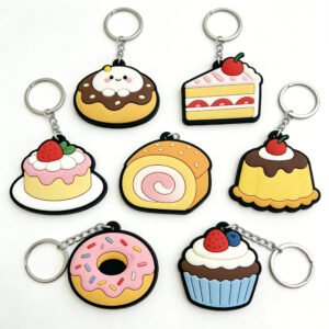 7-piece realistic dessert-shaped PVC soft rubber keychain set including chocolate-glazed donut, strawberry shortcake slice, cherry-topped pudding, rainbow Swiss roll and more; crafted with 3D detailed texturing, vibrant colors, equipped with metal chain and split ring, ideal for daily key organization or cute accents for bags, backpacks and zipper pulls.