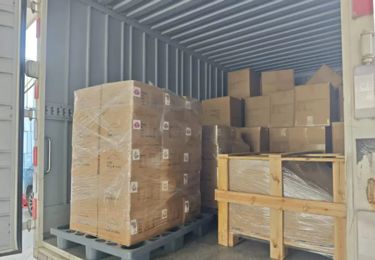 Export cartons and wooden crates loaded inside a shipping container
